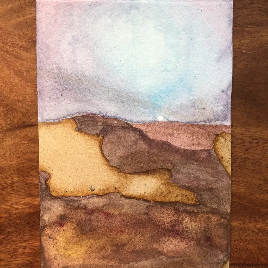 Watercolour and cocoa-ink painting of a sun over a Mars-like landscape.